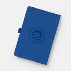 The Obama Presidential Center Hope Journal features a navy blue cover with an embossed circular HOPE wordmark and words like Resilience, Community, Courage, Empathy, and Imagination, shown on a white background.