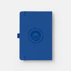 The Obama Presidential Center Hope Journal is a navy blue journal featuring an elastic closure, pen loop, and the HOPE wordmark with "Resilience • Hope • Community • Courage • Empathy • Imagination" embossed on the cover.