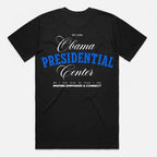 The Obama Presidential Center Script T-Shirt in black features blue and white text, EST. 2026, a Chicago address, and "Inspire Empower & Connect"—a standout piece of Obama Foundation merchandise celebrating the South Side.
