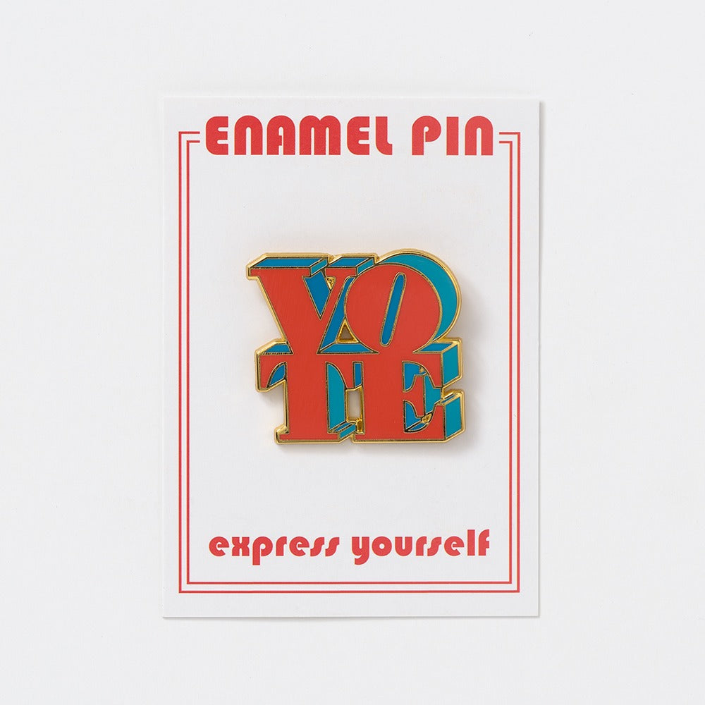 The Vote Pin is a vibrant enamel pin with bold red and teal letters spelling VOTE, attached to a card reading ENAMEL PIN at the top and express yourself at the bottom. Show your civic spirit with the Obama Presidential Center’s Vote Pin.