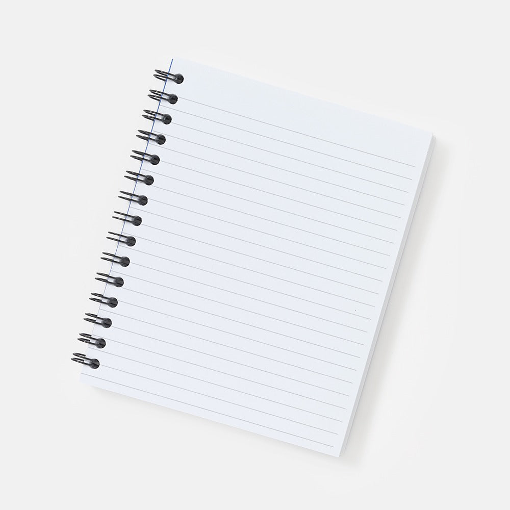 A blank, white, lined Obama Presidential Center Bring Change Home Notebook rests on a light gray background, angled slightly to the right with clean, unwritten pages.
