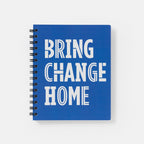 The Obama Presidential Center Bring Change Home Notebook features a blue spiral cover with "BRING CHANGE HOME" in bold, white stylized lettering.