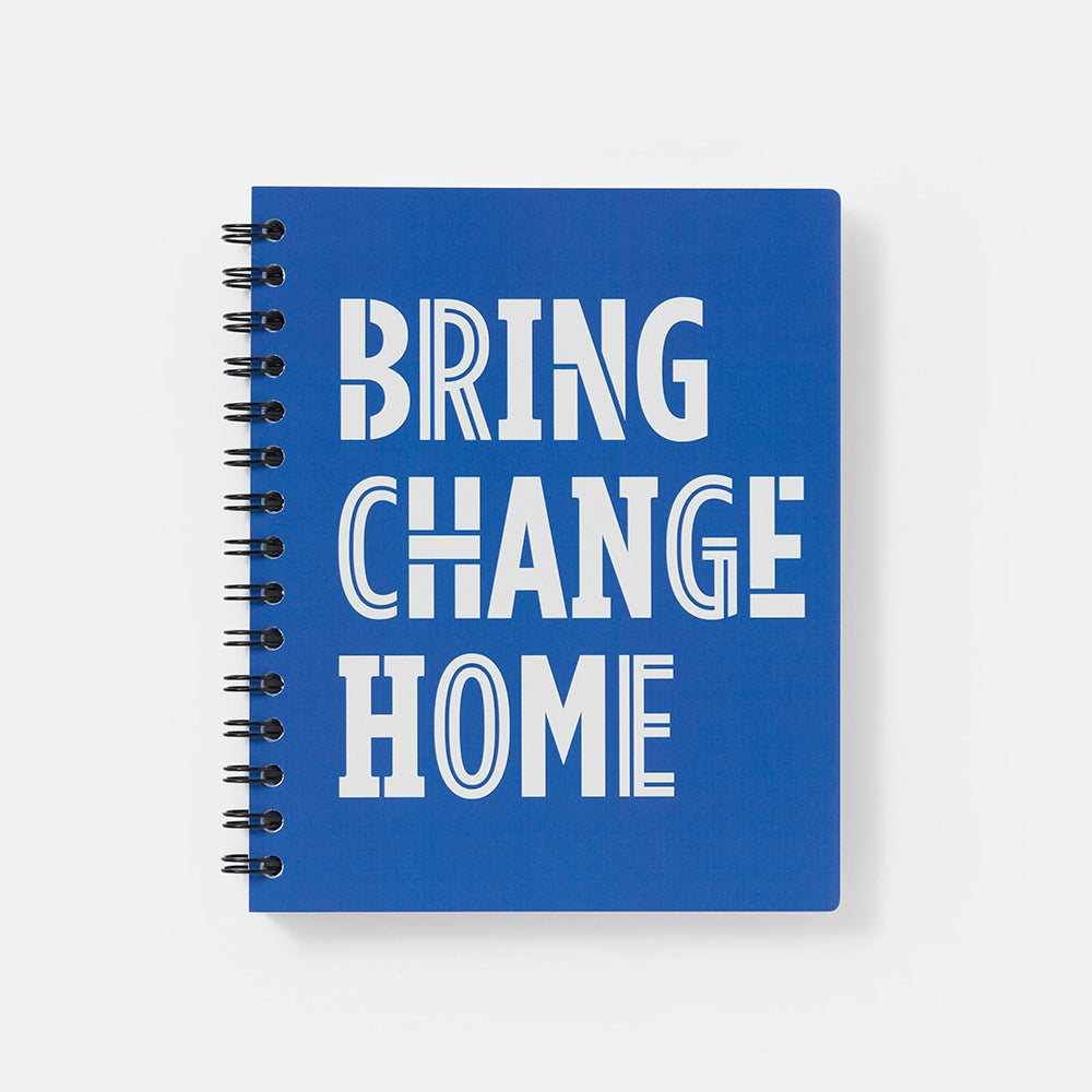 The Obama Presidential Center Bring Change Home Notebook features a blue spiral cover with "BRING CHANGE HOME" in bold, white stylized lettering.