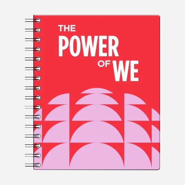 The Obama Foundation Notebook is a red spiral-bound notebook with bold white text “THE POWER OF WE” and overlapping pink semi-circles on the lower half—an inspiring place for your thoughts and ideas.