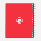 The Obama Foundation Notebook is a red spiral-bound notebook featuring a white circle logo on the cover, symbolizing unity and inspiration—perfect for embodying The Power of We.