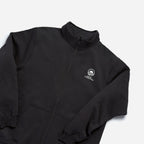 The Obama Foundation Full-zip Fleece is a black jacket featuring a small white logo and “Run for Something” on the left chest, shown against a light gray background.