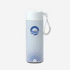 The Obama Foundation Water Bottle, a white stainless steel bottle with a blue circular logo and dot pattern, features a carrying strap on its leak-resistant straw lid and stands upright against a plain light gray background.